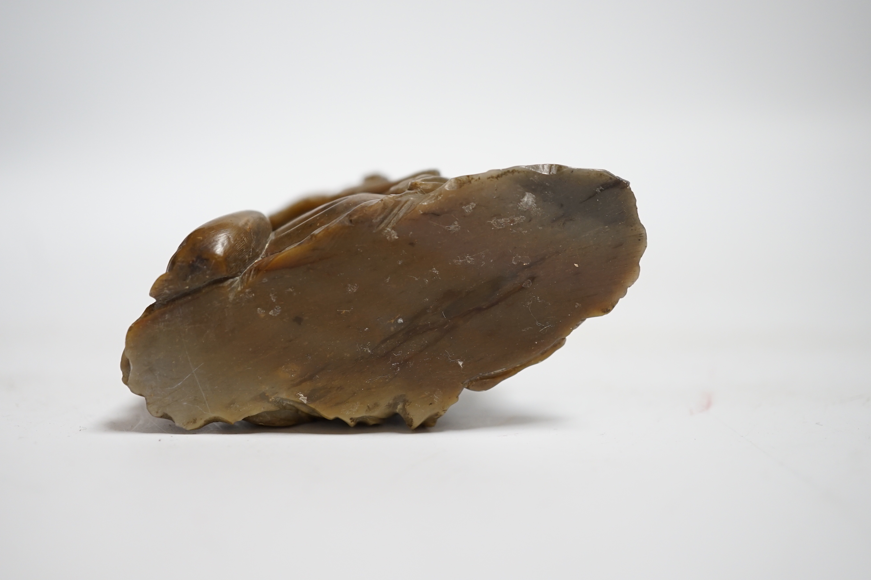 A Chinese soapstone carving of a sage, 7cm wide